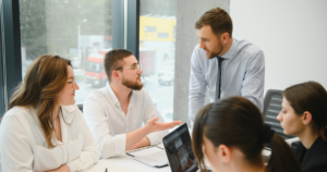 Software development team discussing a financial system integration project during a meeting.